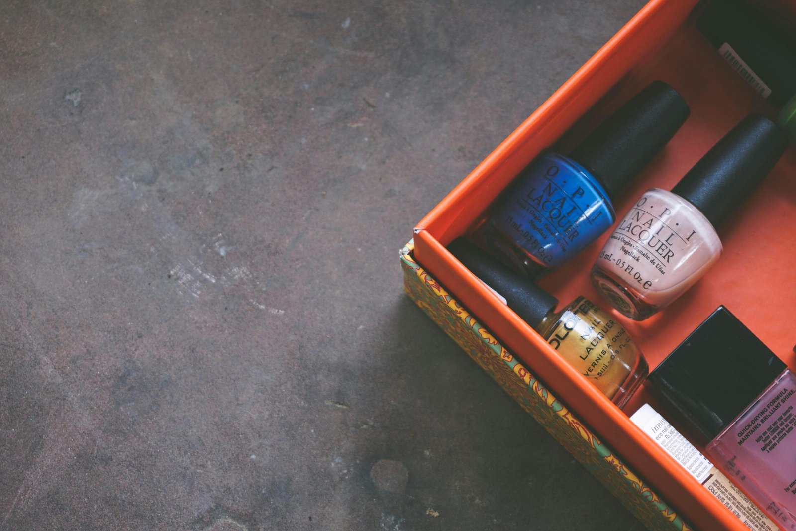 nail polish bottles inside red box